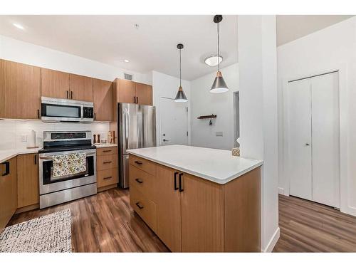 110-16 Auburn Bay Link Se, Calgary, AB - Indoor Photo Showing Kitchen With Stainless Steel Kitchen