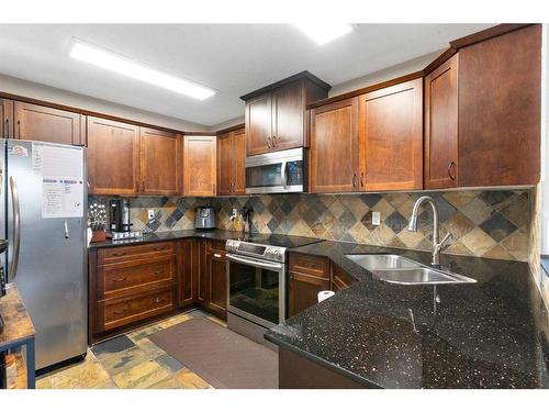 168 Bayside Point Sw, Airdrie, AB - Indoor Photo Showing Kitchen With Double Sink