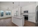 4211-111 Wolf Creek Drive Se, Calgary, AB  - Indoor Photo Showing Kitchen With Stainless Steel Kitchen With Double Sink With Upgraded Kitchen 