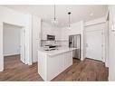 4211-111 Wolf Creek Drive Se, Calgary, AB  - Indoor Photo Showing Kitchen With Double Sink 