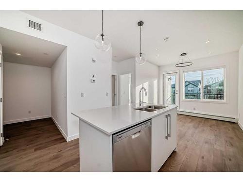 4211-111 Wolf Creek Drive Se, Calgary, AB - Indoor Photo Showing Kitchen With Double Sink With Upgraded Kitchen