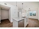 4211-111 Wolf Creek Drive Se, Calgary, AB  - Indoor Photo Showing Kitchen With Double Sink With Upgraded Kitchen 