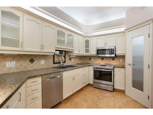 449-8535 Bonaventure Drive Se, Calgary, AB - Indoor Photo Showing Kitchen With Stainless Steel Kitchen With Double Sink