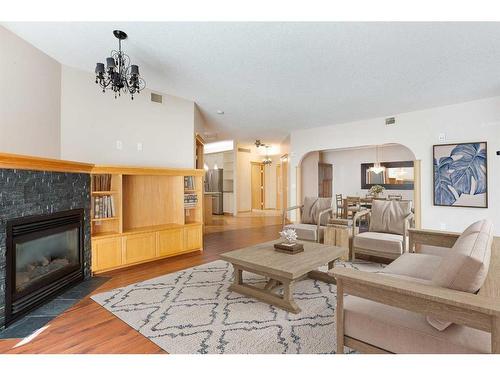 449-8535 Bonaventure Drive Se, Calgary, AB - Indoor Photo Showing Living Room With Fireplace