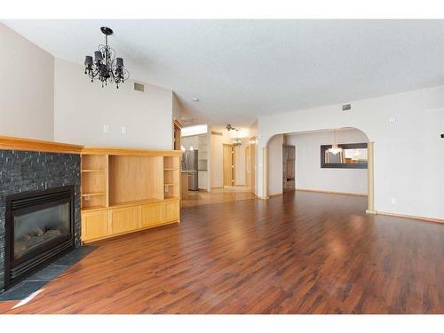 449-8535 Bonaventure Drive Se, Calgary, AB - Indoor Photo Showing Living Room With Fireplace