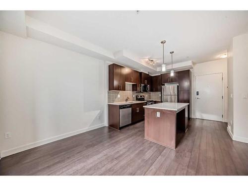 112-15233 1 Street Se, Calgary, AB - Indoor Photo Showing Kitchen With Upgraded Kitchen