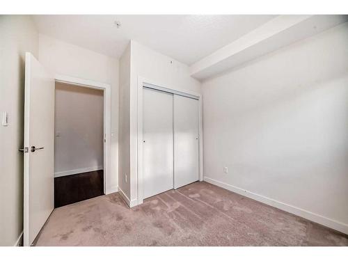 112-15233 1 Street Se, Calgary, AB - Indoor Photo Showing Other Room