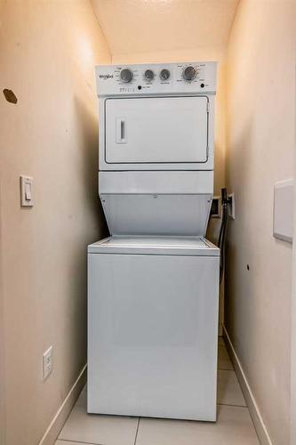 112-15233 1 Street Se, Calgary, AB - Indoor Photo Showing Laundry Room