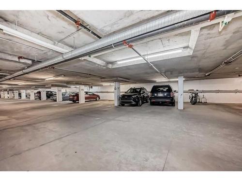 112-15233 1 Street Se, Calgary, AB - Indoor Photo Showing Garage