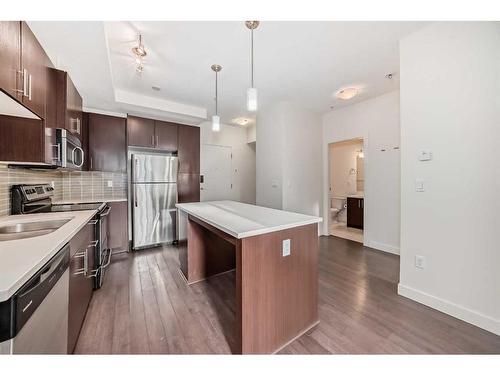 112-15233 1 Street Se, Calgary, AB - Indoor Photo Showing Kitchen With Upgraded Kitchen