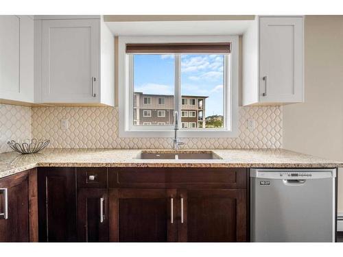 4301-450 Sage Valley Drive Nw, Calgary, AB - Indoor Photo Showing Kitchen With Double Sink