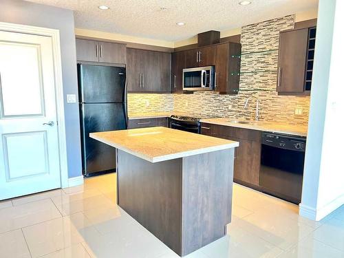 1701-55 Spruce Place Sw, Calgary, AB - Indoor Photo Showing Kitchen