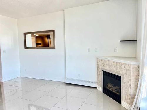 1701-55 Spruce Place Sw, Calgary, AB - Indoor Photo Showing Other Room With Fireplace