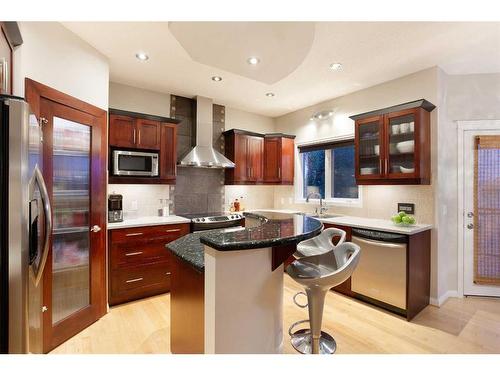 8 Hamptons Place Nw, Calgary, AB - Indoor Photo Showing Kitchen With Stainless Steel Kitchen With Upgraded Kitchen