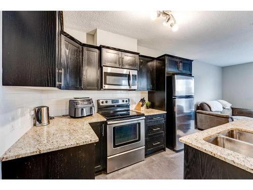 107-117 19 Avenue Ne, Calgary, AB - Indoor Photo Showing Kitchen With Stainless Steel Kitchen With Upgraded Kitchen