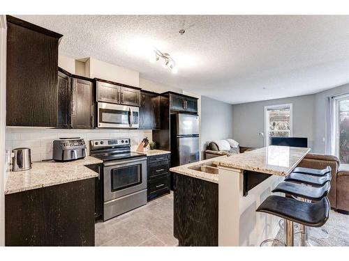 107-117 19 Avenue Ne, Calgary, AB - Indoor Photo Showing Kitchen With Stainless Steel Kitchen With Upgraded Kitchen