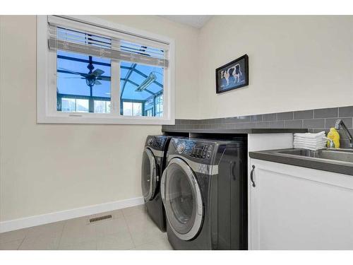 7 Cimarron Estates Manor, Okotoks, AB - Indoor Photo Showing Laundry Room