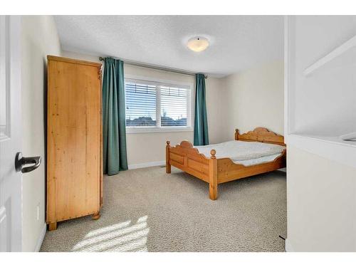 7 Cimarron Estates Manor, Okotoks, AB - Indoor Photo Showing Bedroom