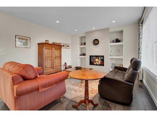 7 Cimarron Estates Manor, Okotoks, AB - Indoor Photo Showing Living Room With Fireplace