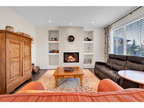 7 Cimarron Estates Manor, Okotoks, AB - Indoor Photo Showing Living Room With Fireplace