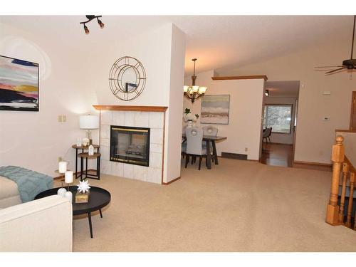 274 Hamptons Park Nw, Calgary, AB - Indoor Photo Showing Living Room With Fireplace