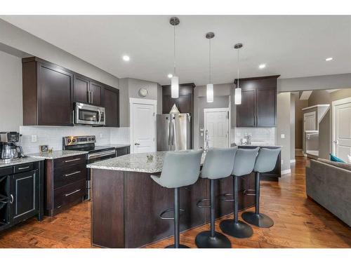 208 Rainbow Falls Green, Chestermere, AB - Indoor Photo Showing Kitchen With Stainless Steel Kitchen With Upgraded Kitchen