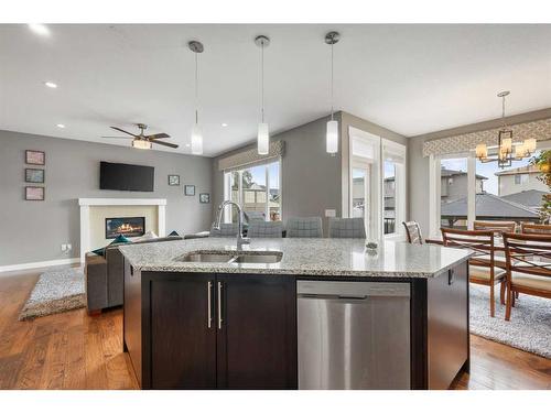 208 Rainbow Falls Green, Chestermere, AB - Indoor Photo Showing Kitchen With Double Sink With Upgraded Kitchen