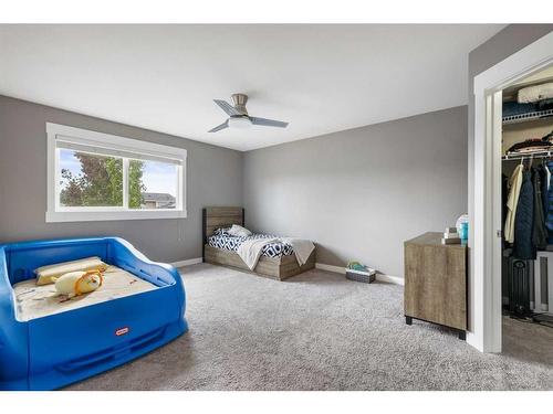 208 Rainbow Falls Green, Chestermere, AB - Indoor Photo Showing Bedroom