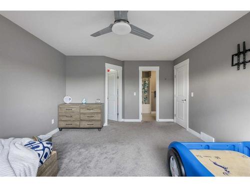 208 Rainbow Falls Green, Chestermere, AB - Indoor Photo Showing Bedroom