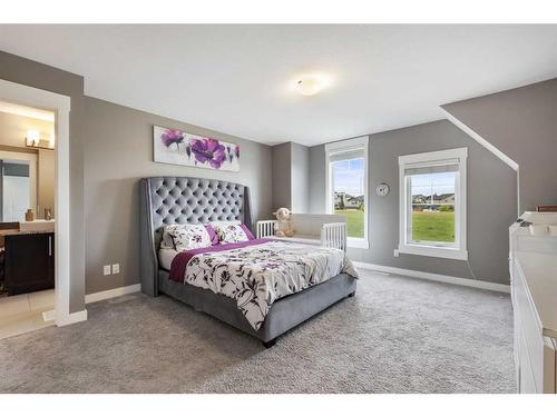 208 Rainbow Falls Green, Chestermere, AB - Indoor Photo Showing Bedroom