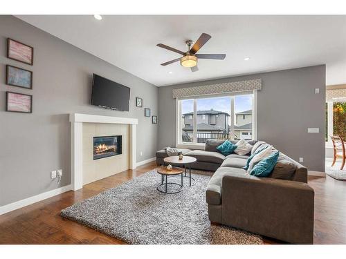 208 Rainbow Falls Green, Chestermere, AB - Indoor Photo Showing Living Room With Fireplace