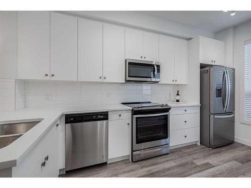 604-15 Evanscrest Park Nw, Calgary, AB - Indoor Photo Showing Kitchen With Stainless Steel Kitchen With Double Sink