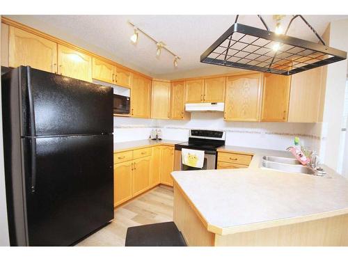 177 Hidden Ranch Road Nw, Calgary, AB - Indoor Photo Showing Kitchen With Double Sink