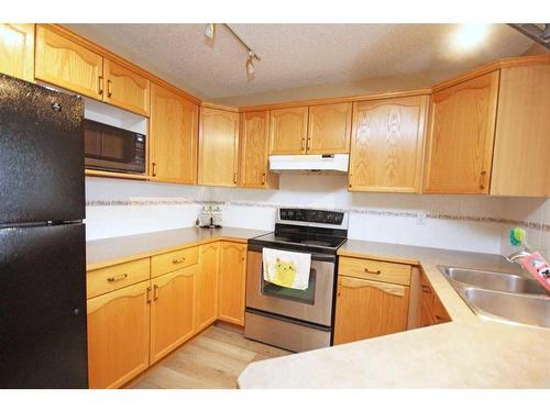 177 Hidden Ranch Road Nw, Calgary, AB - Indoor Photo Showing Kitchen With Double Sink