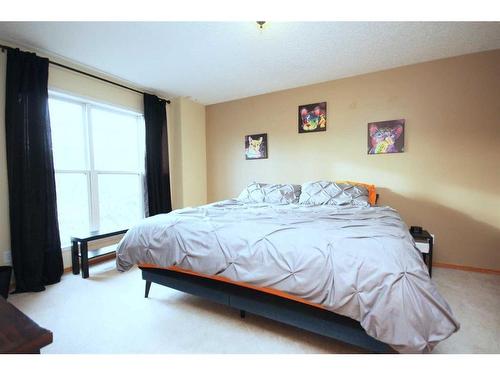 177 Hidden Ranch Road Nw, Calgary, AB - Indoor Photo Showing Bedroom