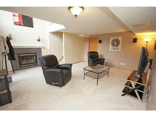 177 Hidden Ranch Road Nw, Calgary, AB - Indoor With Fireplace