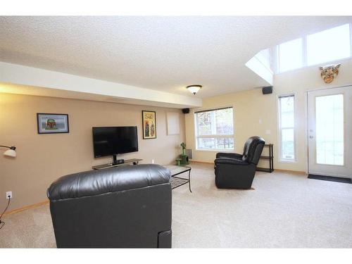 177 Hidden Ranch Road Nw, Calgary, AB - Indoor Photo Showing Living Room