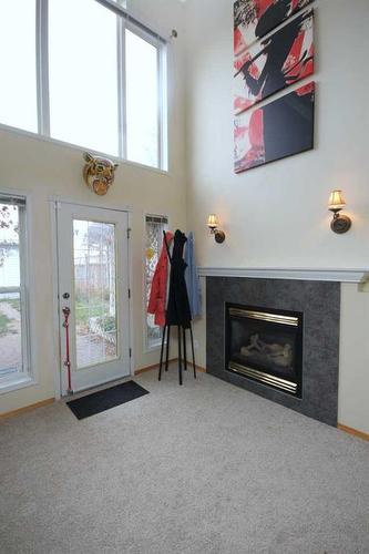 177 Hidden Ranch Road Nw, Calgary, AB - Indoor With Fireplace