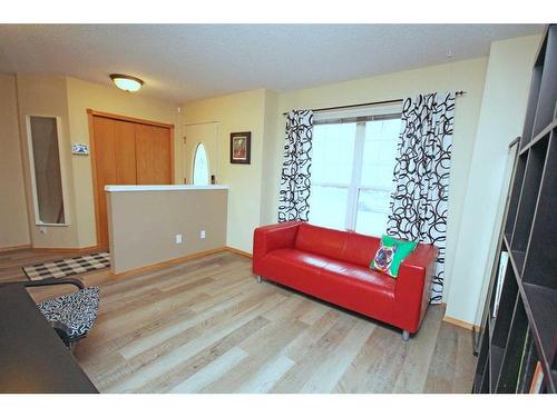 177 Hidden Ranch Road Nw, Calgary, AB - Indoor Photo Showing Living Room