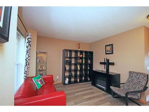 177 Hidden Ranch Road Nw, Calgary, AB - Indoor With Fireplace