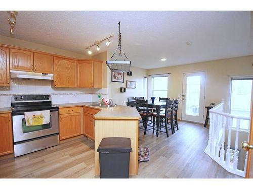 177 Hidden Ranch Road Nw, Calgary, AB - Indoor Photo Showing Kitchen With Double Sink