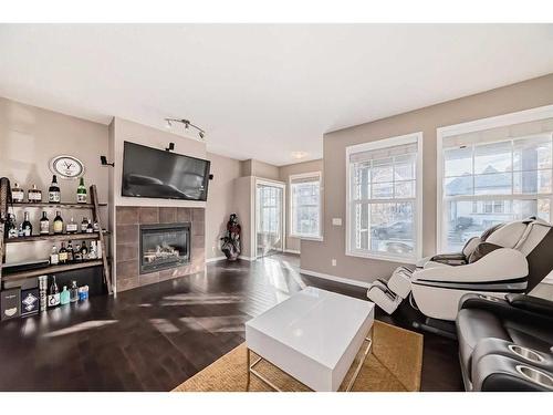 28 Auburn Bay Crescent Se, Calgary, AB - Indoor Photo Showing Living Room With Fireplace