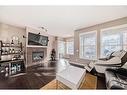 28 Auburn Bay Crescent Se, Calgary, AB  - Indoor Photo Showing Living Room With Fireplace 