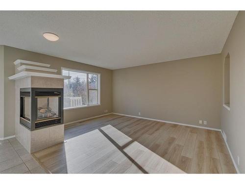 238 Chaparral Court Se, Calgary, AB - Indoor Photo Showing Other Room With Fireplace