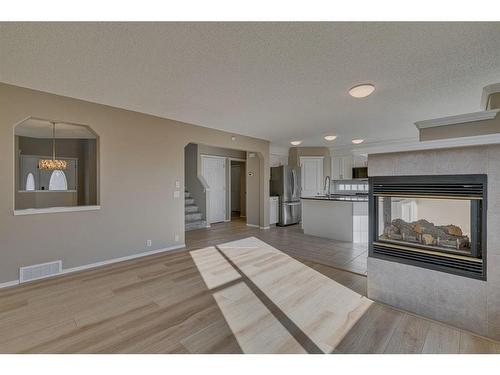 238 Chaparral Court Se, Calgary, AB - Indoor Photo Showing Living Room With Fireplace