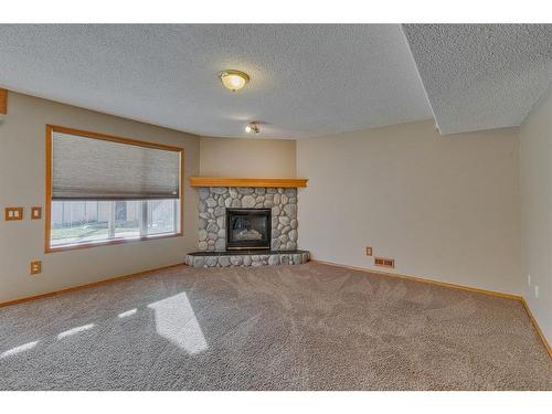 238 Chaparral Court Se, Calgary, AB - Indoor Photo Showing Living Room With Fireplace