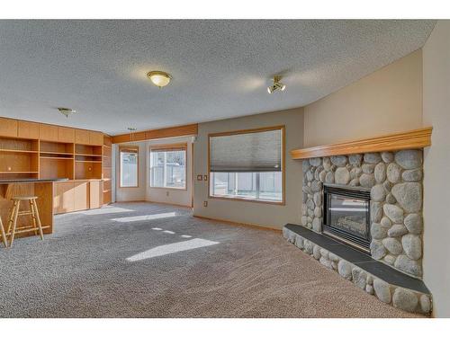 238 Chaparral Court Se, Calgary, AB - Indoor Photo Showing Living Room With Fireplace