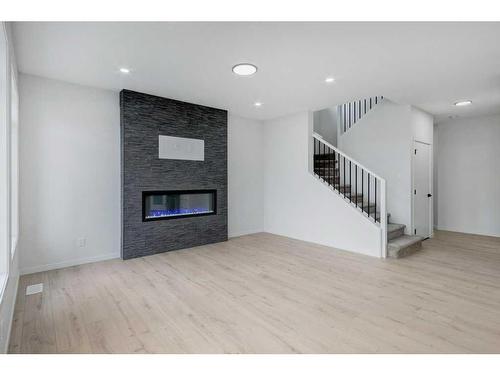 370 Corner Glen Way Ne, Calgary, AB - Indoor Photo Showing Living Room With Fireplace