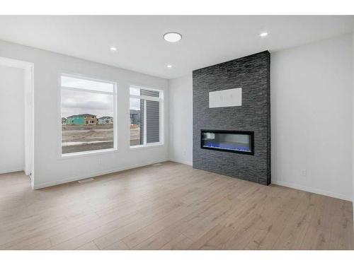 370 Corner Glen Way Ne, Calgary, AB - Indoor Photo Showing Living Room With Fireplace