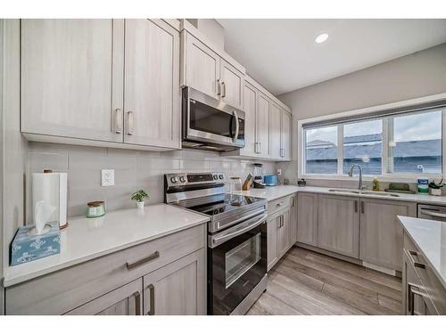 119 Creekstone Drive Sw, Calgary, AB - Indoor Photo Showing Kitchen With Double Sink With Upgraded Kitchen